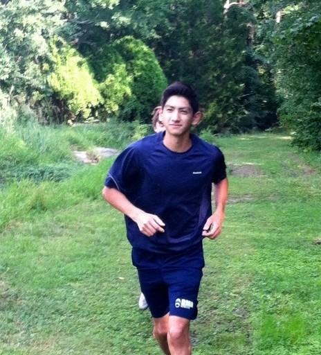 Cross Country runner, Stephen Ward, practices the RMA course route during a Summer workout