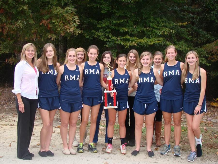 Last years girls cross-country team with their EPIC Conference Meet trophy