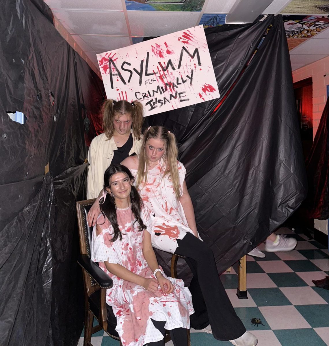Seniors Jodie Coble, Gabbi Ams, and Madisyn Rogers dressed up for the Haunted Hall!