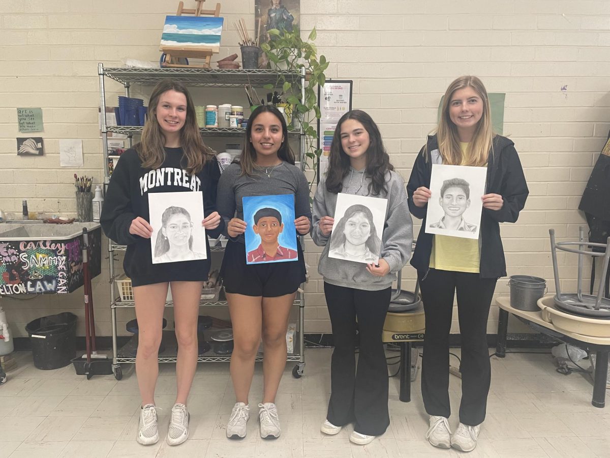 From left to right: Ann Cleveland Fisher, Julie Ariza, Sadie Meadows, and Elizabeth Paszek with their portraits for the Memory Project