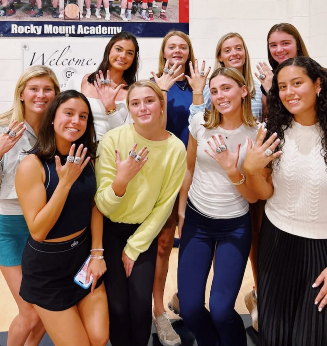 Varsity girls basketball players show off their new hardware.